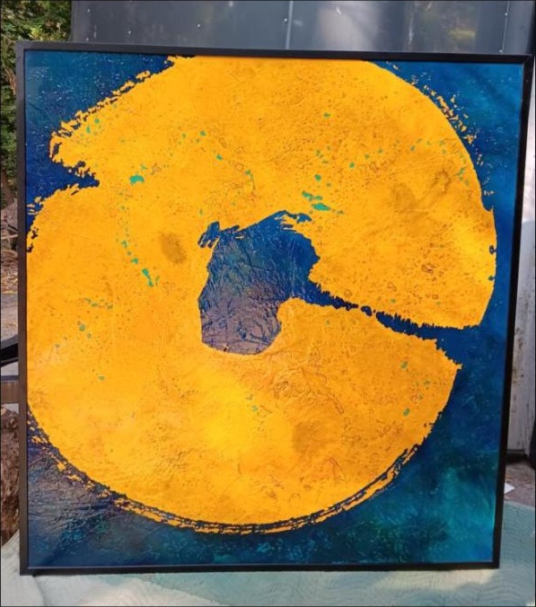 Yellow orb on blue abstract