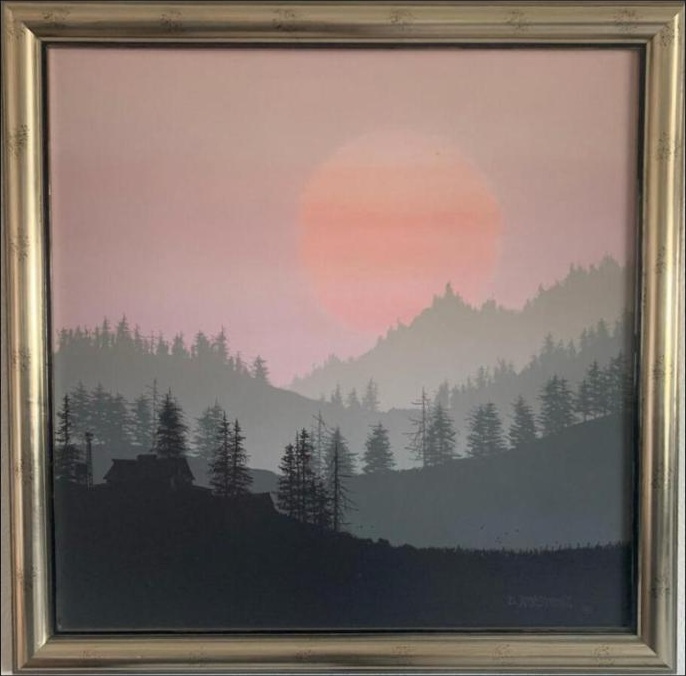 Pink sunset over forested hills